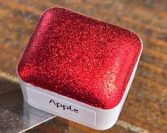 Pinturas de acuarela hechas a mano de Navidad de manzana en media pastilla