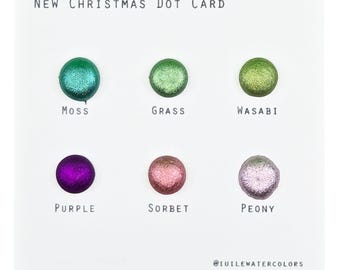 May include: New Christmas Dot Card with six paint swatches in the colors moss, grass, wasabi, purple, sorbet, and peony.