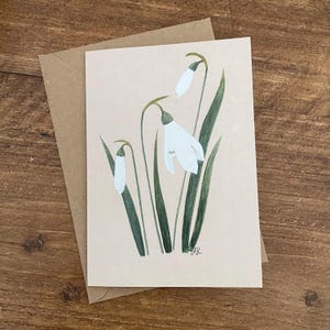 Biglietto d'auguri botanico con bucaneve e busta, interno vuoto