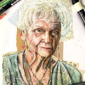 May include: Mixed media portrait of an elderly woman with white hair, wearing a patterned teal top and a long necklace with a pendant. The artwork is created with coloured pencils and collage elements.