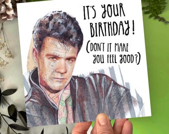 May include: A white card with a black and white illustration of a man with a serious expression. The text on the card reads "It's your birthday! (Don't it make you feel good?)"
