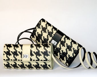 Clutch Lambskin Aimee en un patrón tejido de sabueso, clásico en blanco y negro