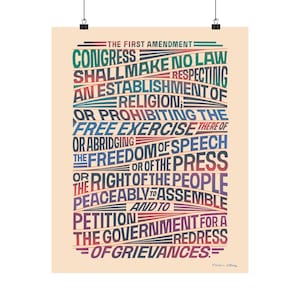 May include: A poster featuring the text of the First Amendment to the U.S. Constitution. The text is arranged in colorful, stylized lines against a beige background. The words "Congress," "Freedom of Speech," and "Petition" are prominent.