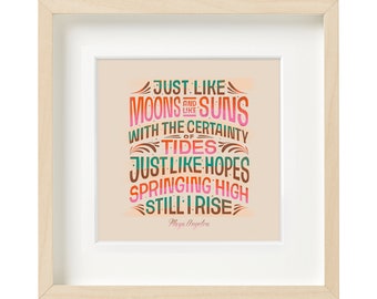 May include: A framed print with a peach background and a quote in colorful lettering that reads "Just like moons and suns with the certainty of tides just like hopes springing high still I rise" by Maya Angelou.