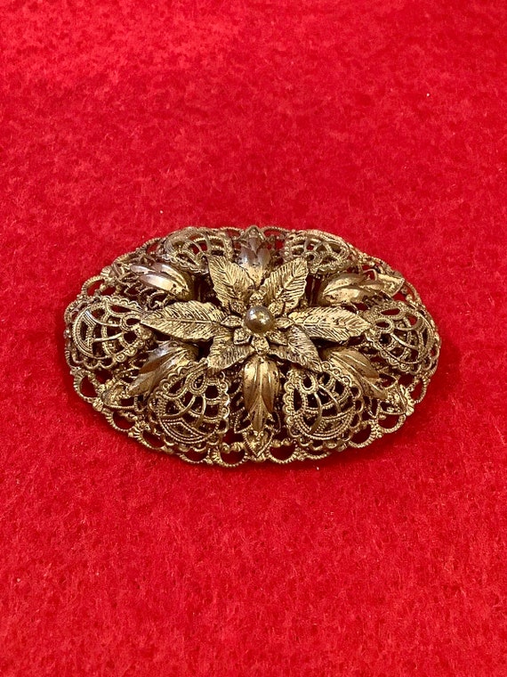 Vintage Domed Pressed Filigree Metal Floral Brooch - image 1