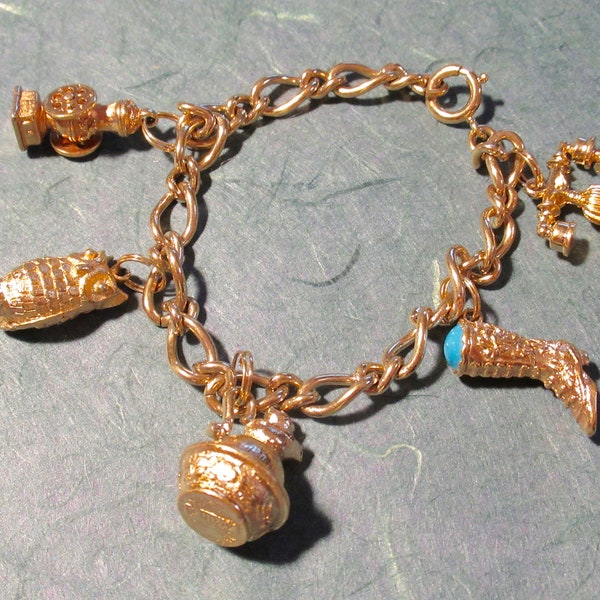 5 Charm Bracelet 7 inch Gold Tone signed Avon: Owl, Pitcher, Coffee Mill, Telephone, Cowboy