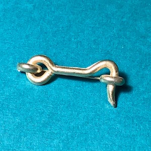 May include: A set of three ceramic mugs with a speckled, matte finish in cream, light grey, and dark grey. Each mug has a simple, minimalist design, suitable for coffee or tea.