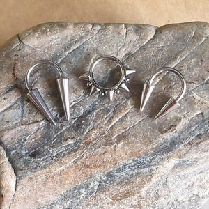 3-delige set 16 g piercingsieraden, scharnierende klikker, lang tussenschot met stekels, tussenschotring, tussenschotring met steker, hoefijzerhalter, klikring