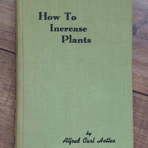 May include: A green book titled "How To Increase Plants" by Alfred Carl Hottes.