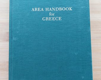 May include: A teal blue hardcover book with the title "AREA HANDBOOK for GREECE" printed in white on the front cover.