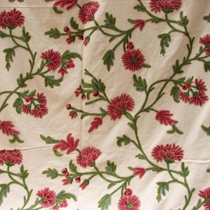 Crewel Embroidered Cotton Fabric: Rambling Garden sold by the yard. We can craft curtains to your specifications. Contact us for a quote.
