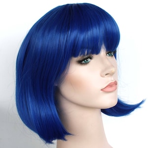 Vibrant blue bob wig with bangs for women. Premium smooth short blue wig. High quality synthetic hair. Ready to ship.