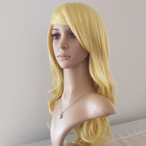 28 inch light yellow blonde wavy long wig for women. Daily wearing long wig. Heat resistant synthetic hair. Ready to ship. Free US shipping.