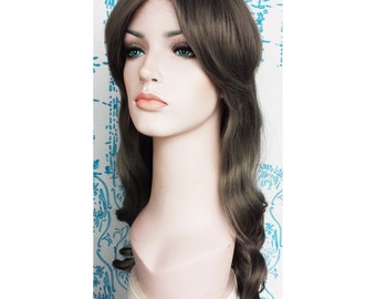 May include: A long, brown wig with a side part and loose waves. The wig is styled with a fringe and falls to the shoulders.
