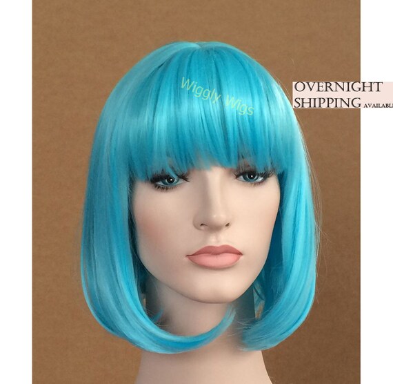 Aqua blue bob wig for women. Sky blue women s costume wig with bangs. High quality synthetic blue hair. Ready to ship. in USA