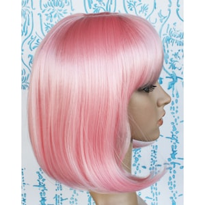 Pink bob wig with bangs for women. Light pink straight wig. Holiday party hair. High quality synthetic hair. Free US shipping. Ready to ship