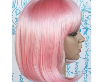 Pink bob wig with bangs for women. Light pink straight wig. Holiday party hair. High quality synthetic hair. Ready to ship. Free US shipping