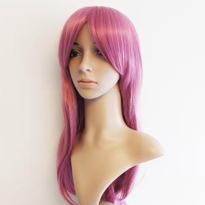 Magenta pink long wavy wig for women. Premium natural looking high quality synthetic long pink hair. ready to ship. Free US shipping.