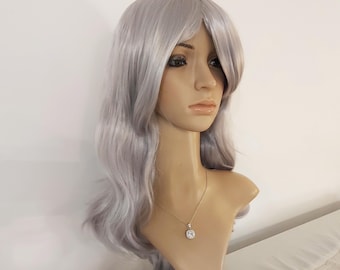 May include: A silver wig with long, wavy hair. The wig is styled with a side part and has a slight fringe. The wig is on a mannequin head.