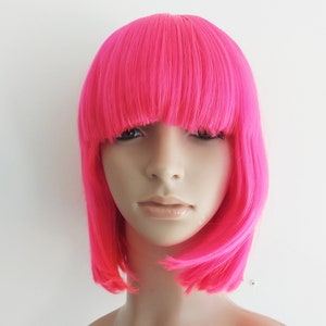 Hot pink bob wig with bangs for women. Premium natural looking costume hot pink hair. Mardi Gras wig.  Free shipping in USA. Ready to ship.