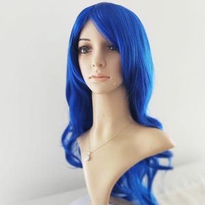 Blue long wavy wig for women. Premium natural looking party costume blue wig. High quality synthetic hair. Ready to ship. Free US shipping.