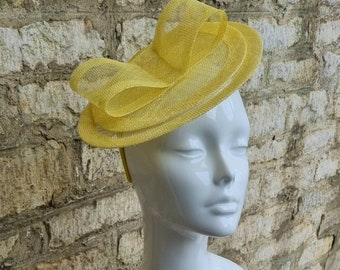 Yellow fascinator hat on headband mini oval hatinator for races tea party or wedding