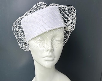 White pillbox stewardess style cocktail hat with veil. Wedding hat formal wear