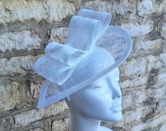 White fascinator hat for wedding simple white sinamay teardrop design hat on headband.