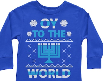 May include: A blue long-sleeved shirt with a white snowflake design and the text "OY TO THE WORLD" in blue and white. The shirt also features a blue menorah design.