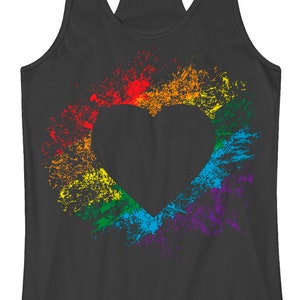 May include: A dark gray tank top with a rainbow heart design. The heart is made of colorful paint splatters.