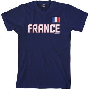 May include: A navy blue t-shirt with a white and red French flag and the word "FRANCE" in white letters with red outlines.
