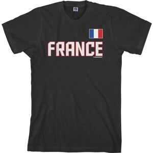 May include: Black t-shirt with a white and red "FRANCE" graphic and a small French flag in the upper right corner.