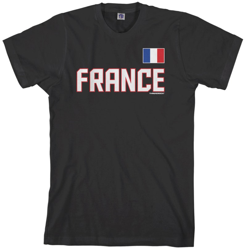 May include: Black t-shirt with a white and red "FRANCE" graphic and a small French flag in the upper right corner.