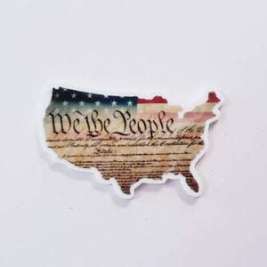 Retenedor de agujas con la bandera de Nosotros el Pueblo