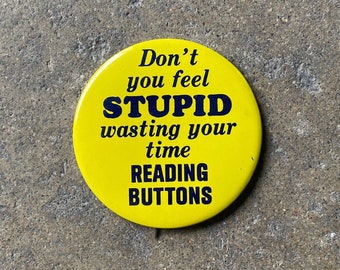 70's Don't You Feel Stupid Wasting Your Time Reading Buttons Button