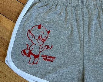 Women’s vintage style high waist light grey jogger shorts with traditional tattoo Hot Stuff devil