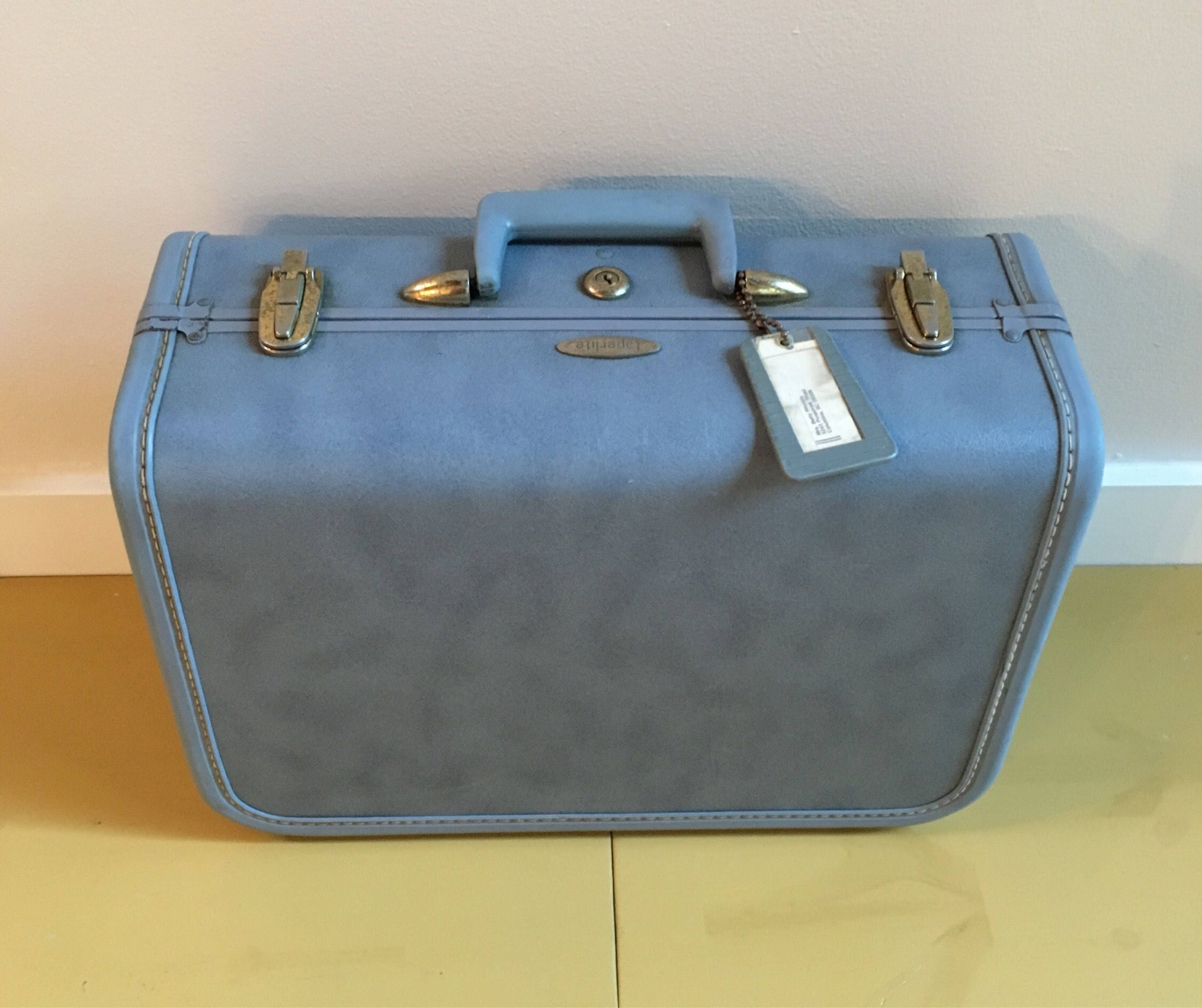taperlite vintage luggage
