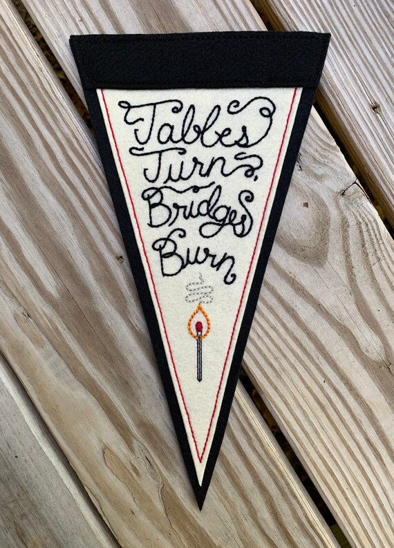 ‘Tables Turn, Bridges Burn’ off-white & black hand-stitched large felt pennant with lit match