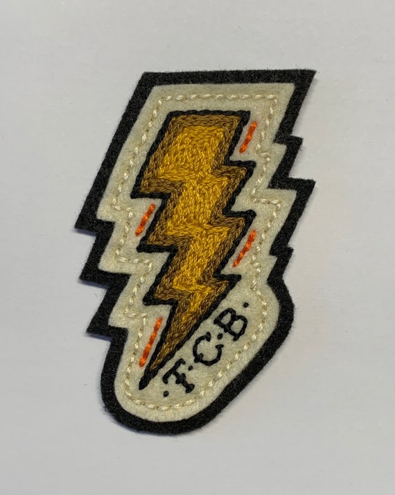 Yellow & gold TCB lightning bolt patch