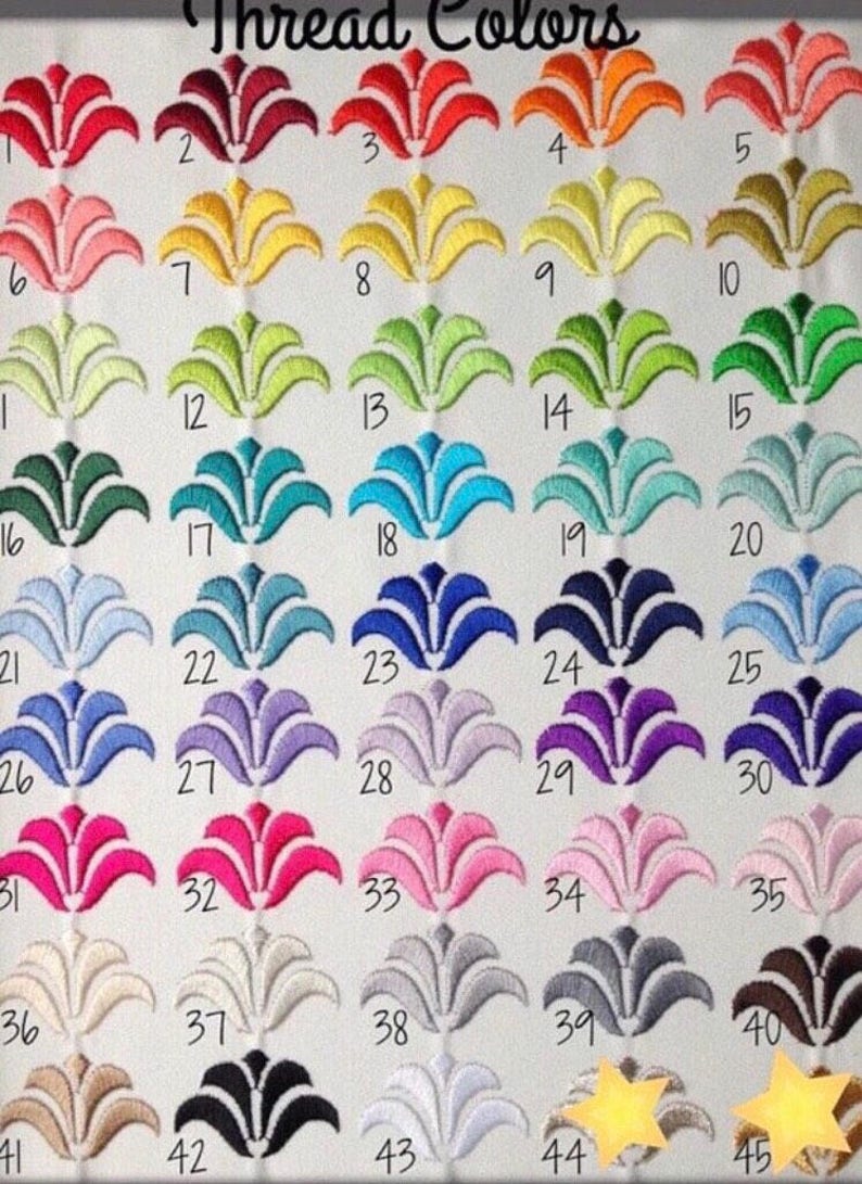 May include: A color chart titled Thread Colors featuring forty-five numbered embroidered floral motifs in various shades including red, orange, yellow, green, blue, purple, pink, grey, brown, black, and white, arranged in a grid on white fabric.