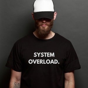 May include: A black t-shirt with white text that reads "SYSTEM OVERLOAD."
