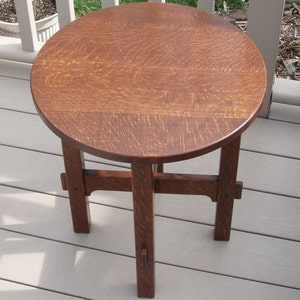 A reproduction Stickley 603 Tabouret.