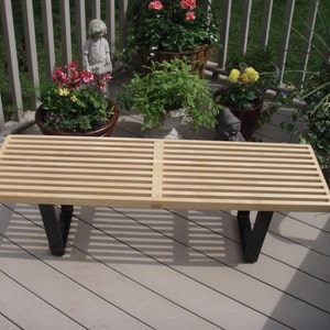 A George Nelson inspired Slat Bench.  Bench is hand crafted inHard Maple