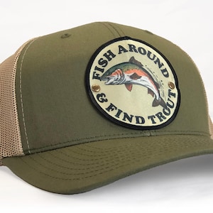 May include: A green and tan trucker hat with a patch that says "Fish Around & Find Trout" and features a trout illustration.