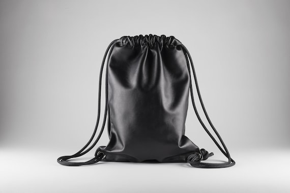 black leather drawstring backpack