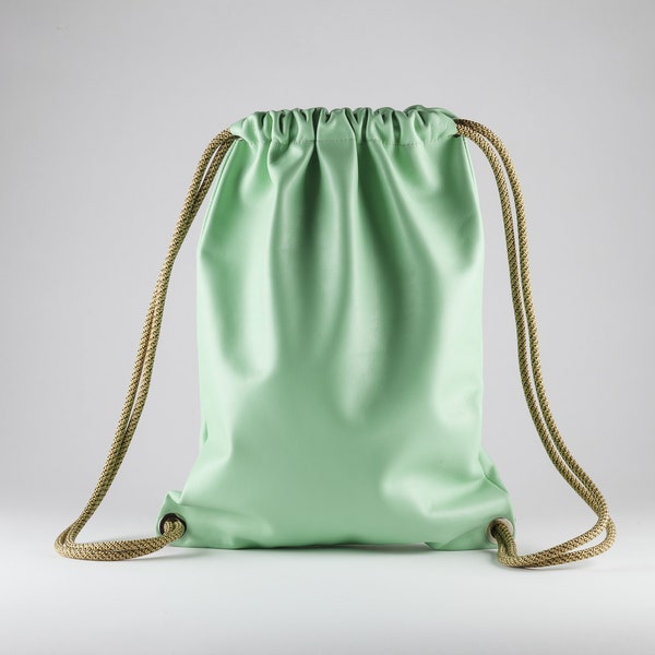 Premium Italian leather drawstring backpack in mint green.