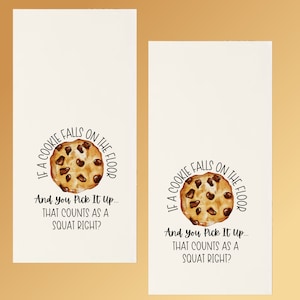 May include: A white card with a brown chocolate chip cookie graphic and the text "If a cookie falls on the floor and you pick it up... that counts as a squat right?"