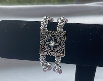 Bracelet. Silver filigree with Swarovski crystal on two strands of woven chan