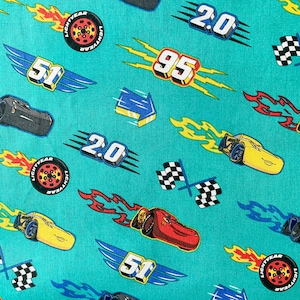 NEW. Disney Cars Racing on Teal 100% Cotton Fabric **Ships from California ##Click Item Details