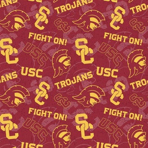 May include: A red and gold pattern with the words "Fight On!" and "USC Trojans" repeated. The pattern also includes a stylized "SC" logo and a helmet with a Spartan warrior's head.